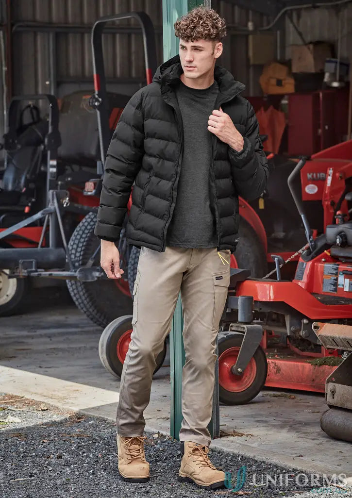 Man modeling Men’s Essential Basic Stretch Cargo Pants with black puffer jacket and work boots