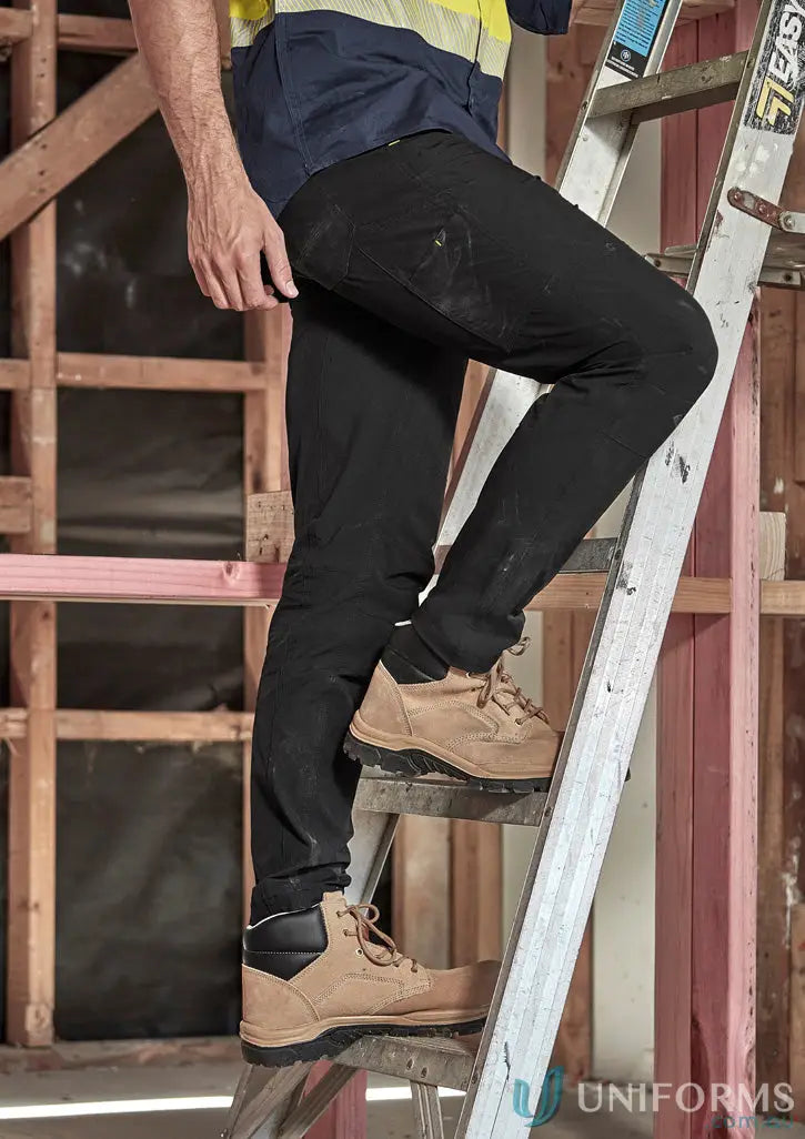 Workman climbing ladder in tan work boots wearing Mens Lightweight Outdoor Pant with large cargo pocket for ultimate comfort