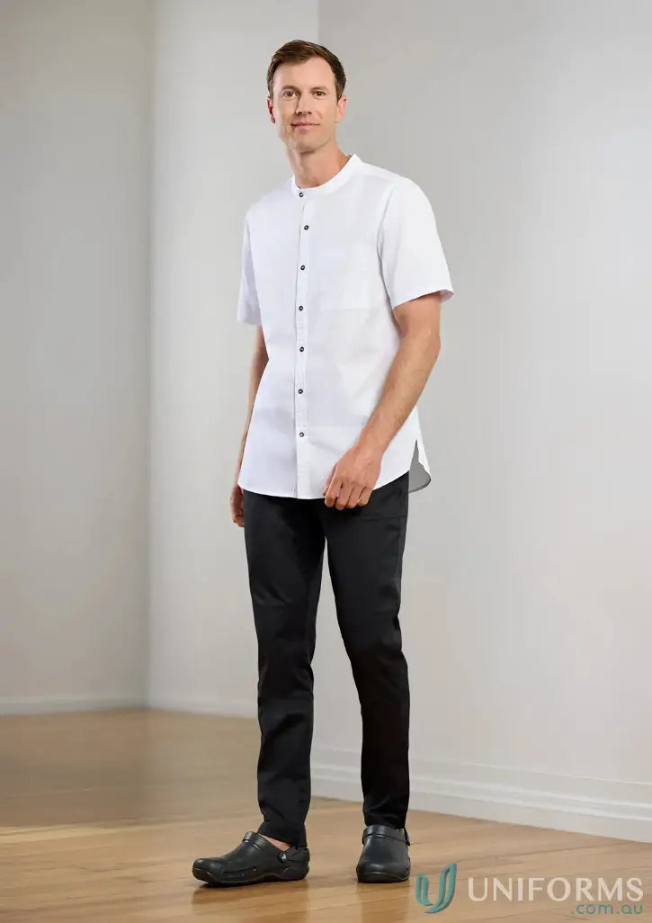 Man in white tunic and black pants wearing Mens Saffron Chef Flex Pant for professional style