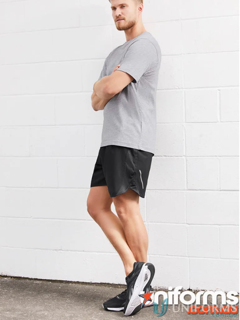 Man wearing Mens Tactic Shorts with mesh panels and st511m fit in athletic apparel