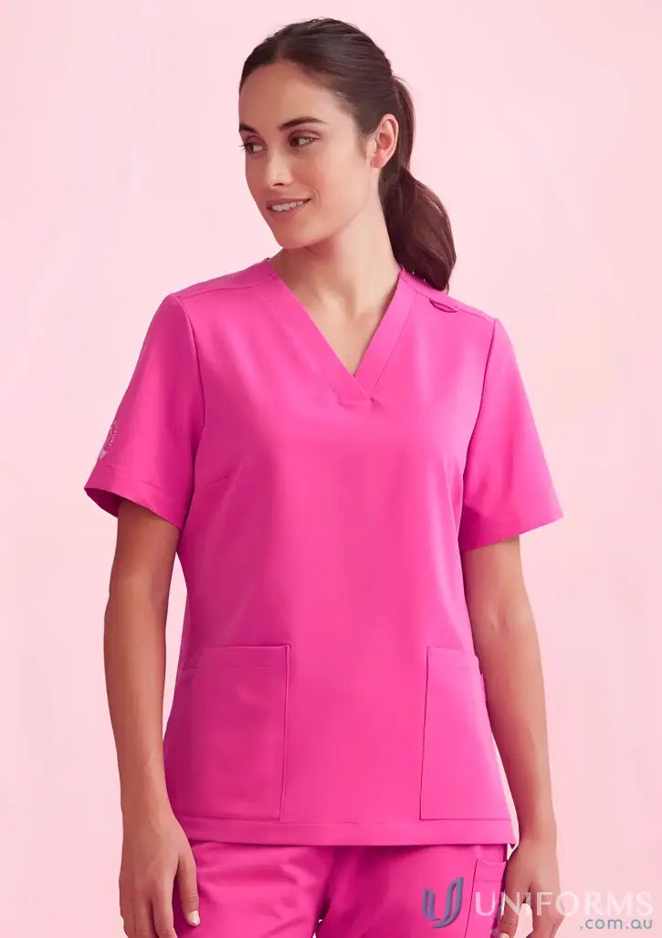 Hot pink bizcare women’s pink V-neck scrub top for work confidently