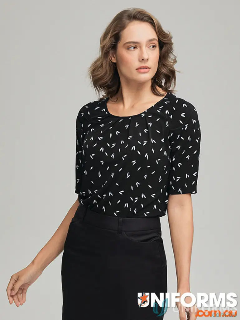 Woman wearing Petal Print Knit blouse with city collection petal skirt in recycled polyester