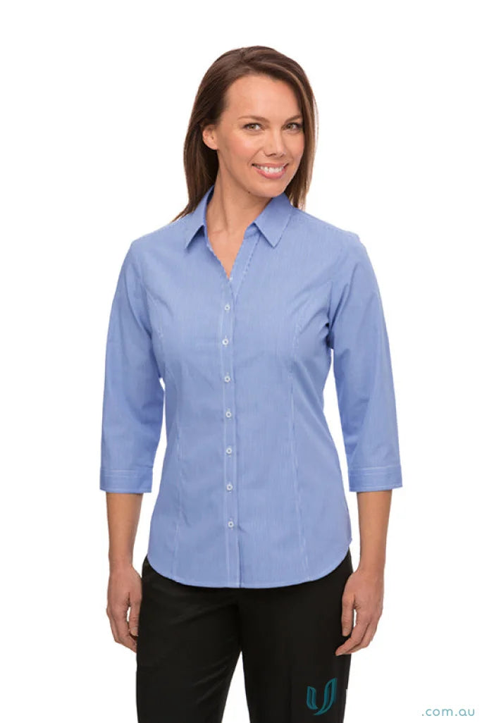 Woman in Pippa Check workwear uniform with princess line and light blue shirt