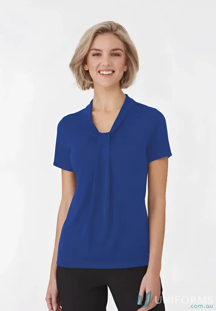 Woman in a Pippa Ladies SS Top with soft draped neckline and comfy fit