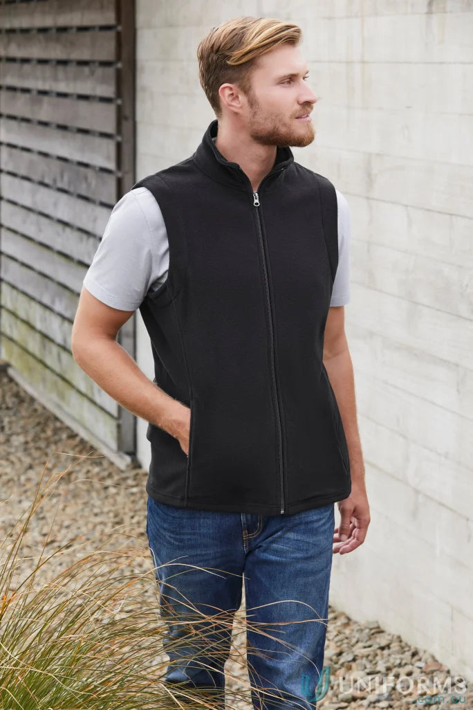 Man wearing black micro fleece vest over grey t-shirt and jeans, biz collection men’s