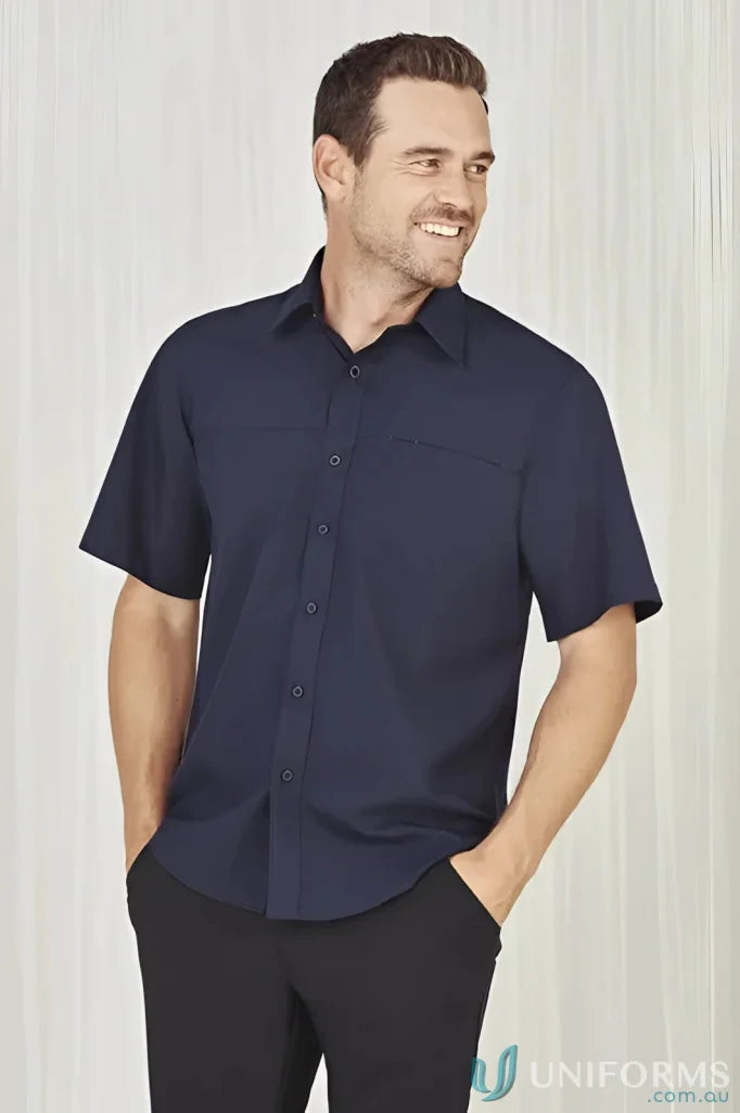 Man in navy men’s Oasis Short Sleeve Shirt, perfect for casual summer looks