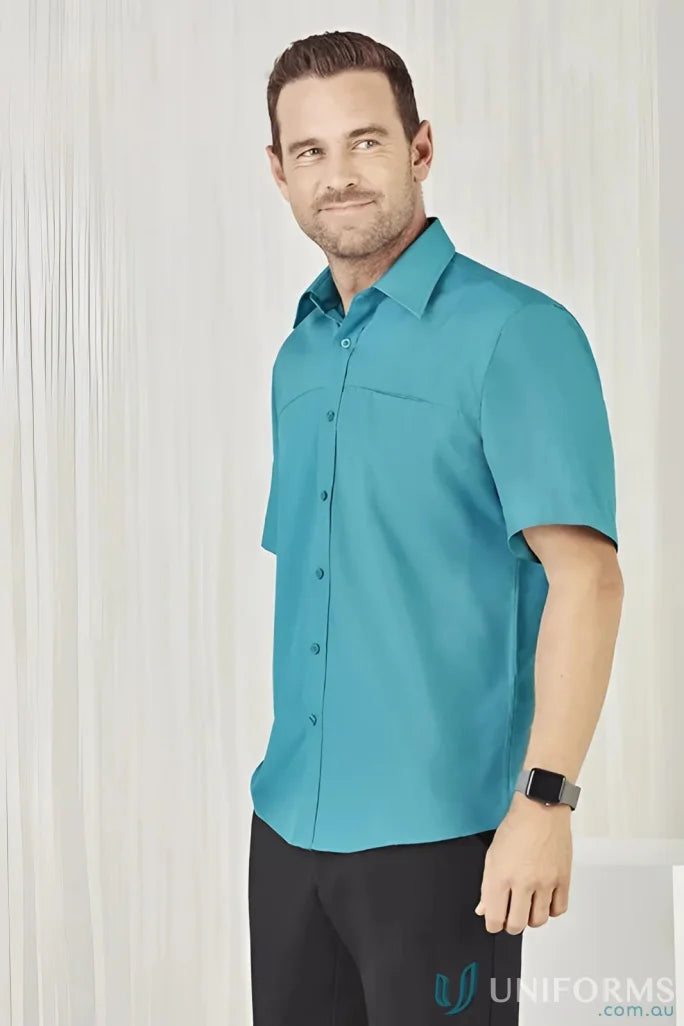 Man in teal Men’s Oasis Short Sleeve Shirt, perfect for casual style