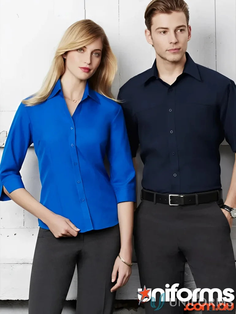 Two men wearing stylish men’s oasis short sleeve shirts and pants