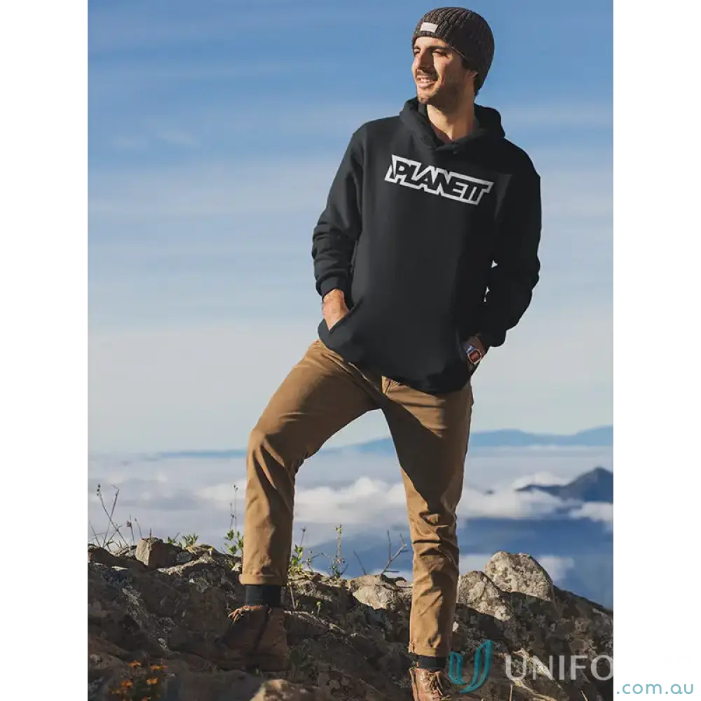 Man in Planett Hike Hoodie made from ethically sourced Australian cotton on mountain peak