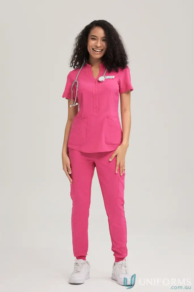 Pink medical scrubs with stethoscope from City Collection Pocket, made with recycled polyester for all-day comfort and 4-way stretch non-stop motion