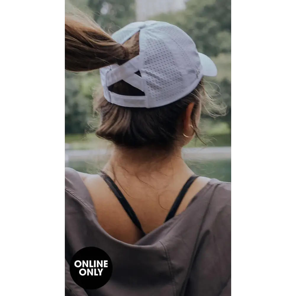 White mesh ponytail active cap with adjustable strap and curved brim perfect for work uniforms and workwear