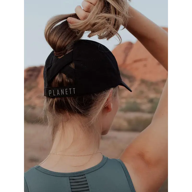 Black ponytail active cap showing back side with planett embroidery perfect for work uniforms and workwear