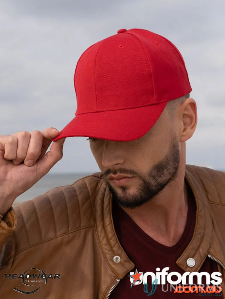 Man in red baseball cap and brown leather jacket, perfect for uniforms or workwear