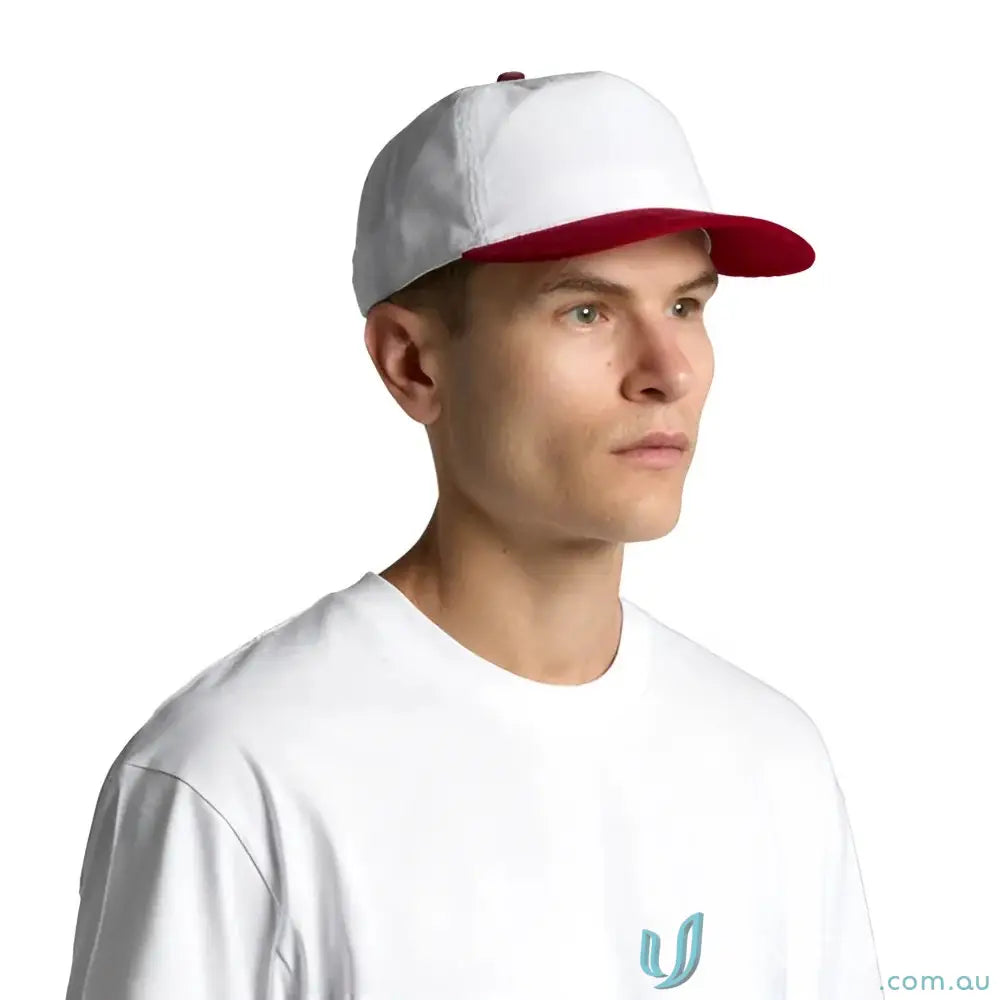 Person wearing a white cotton 16-wale partridge cord cap with red brim and white tee
