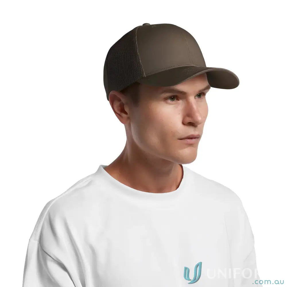 Man wearing olive-green high profile mesh trucker cap with shallow curved peak