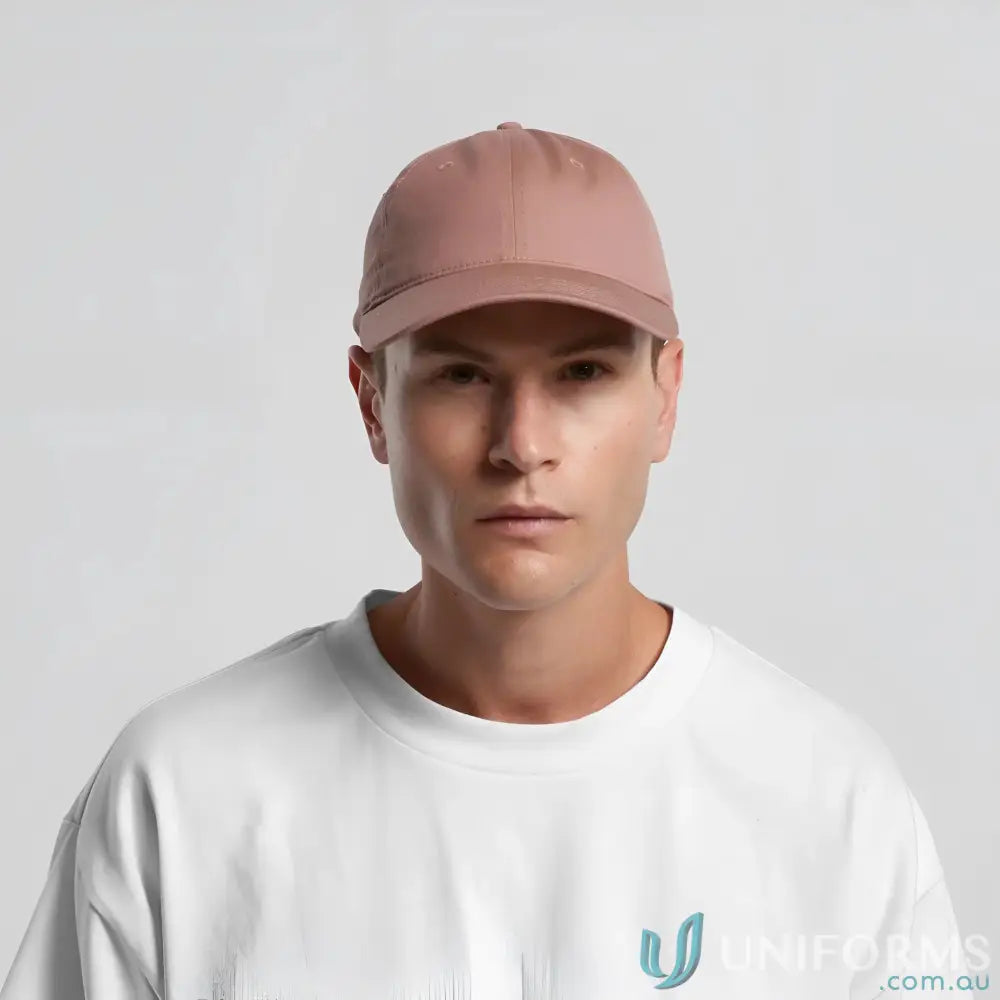 Light brown baseball cap with adjustable metal clasp on man’s head for a casual look
