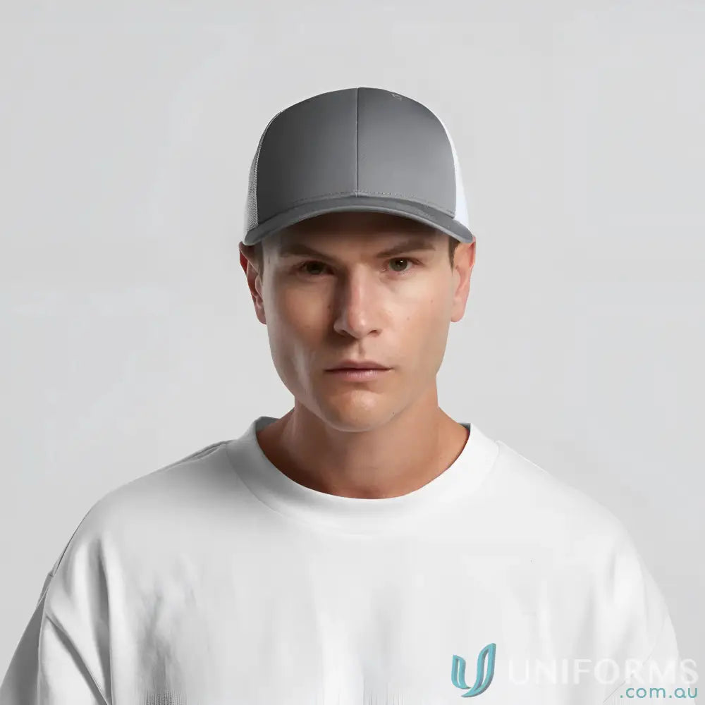 Man wearing grey and white baseball cap made of recycled polyester mesh with curved peak
