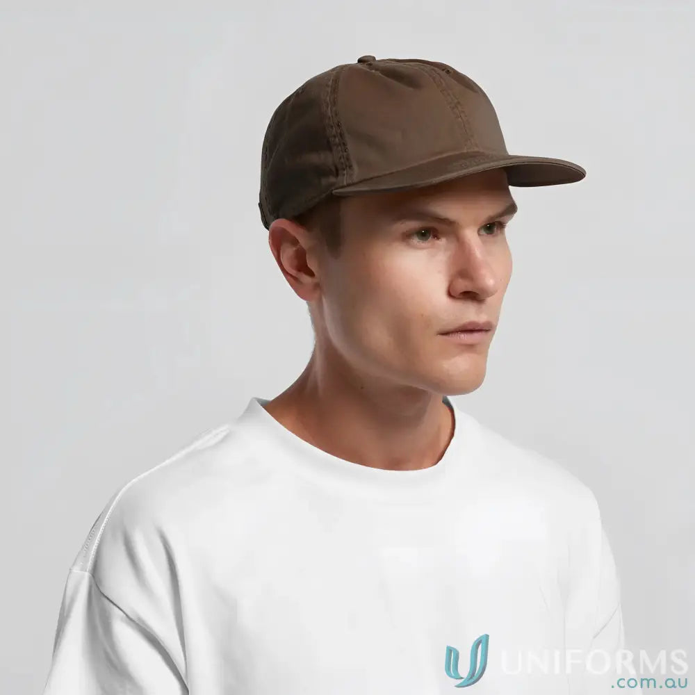 Man in white t-shirt wearing a Premium Mid-Profile Cotton Cap with flat peak and metal clasp