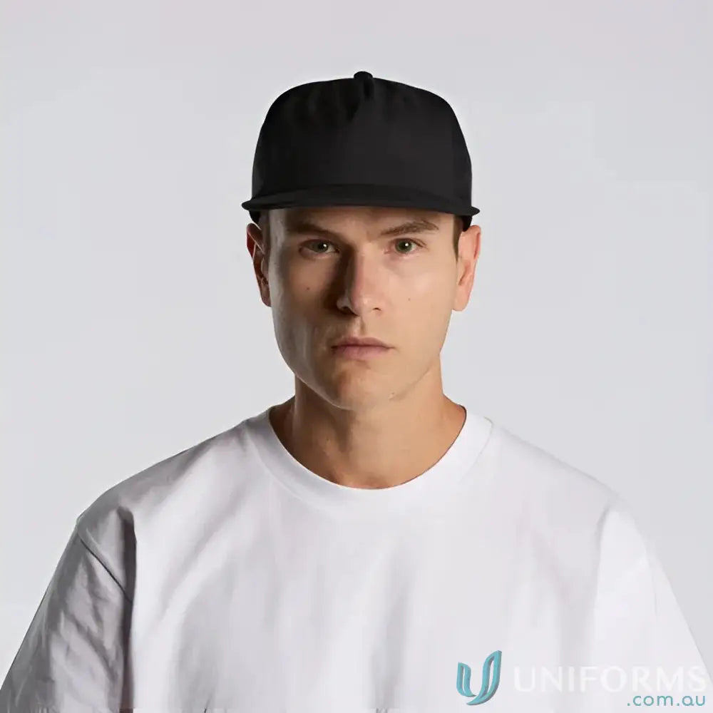 Man wearing black flat-brimmed baseball cap with fleece lining and recycled polyester fabric