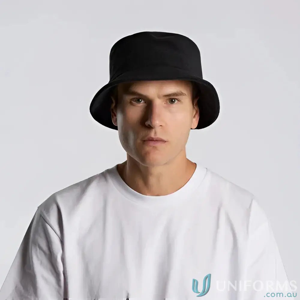 Man in white t-shirt wearing black cotton terry bucket hat with reinforced stitching