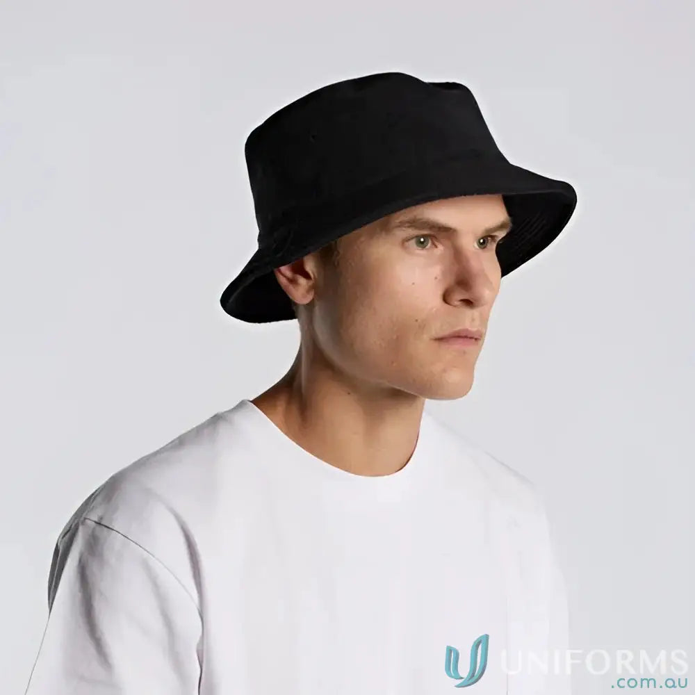 Man wearing a black cotton terry bucket hat with reinforced stitching for uniforms