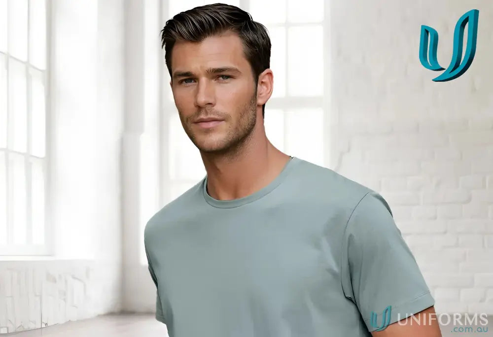 Man wearing a light green Premium Mornington T-Shirt, winning spirit premium cotton face tee