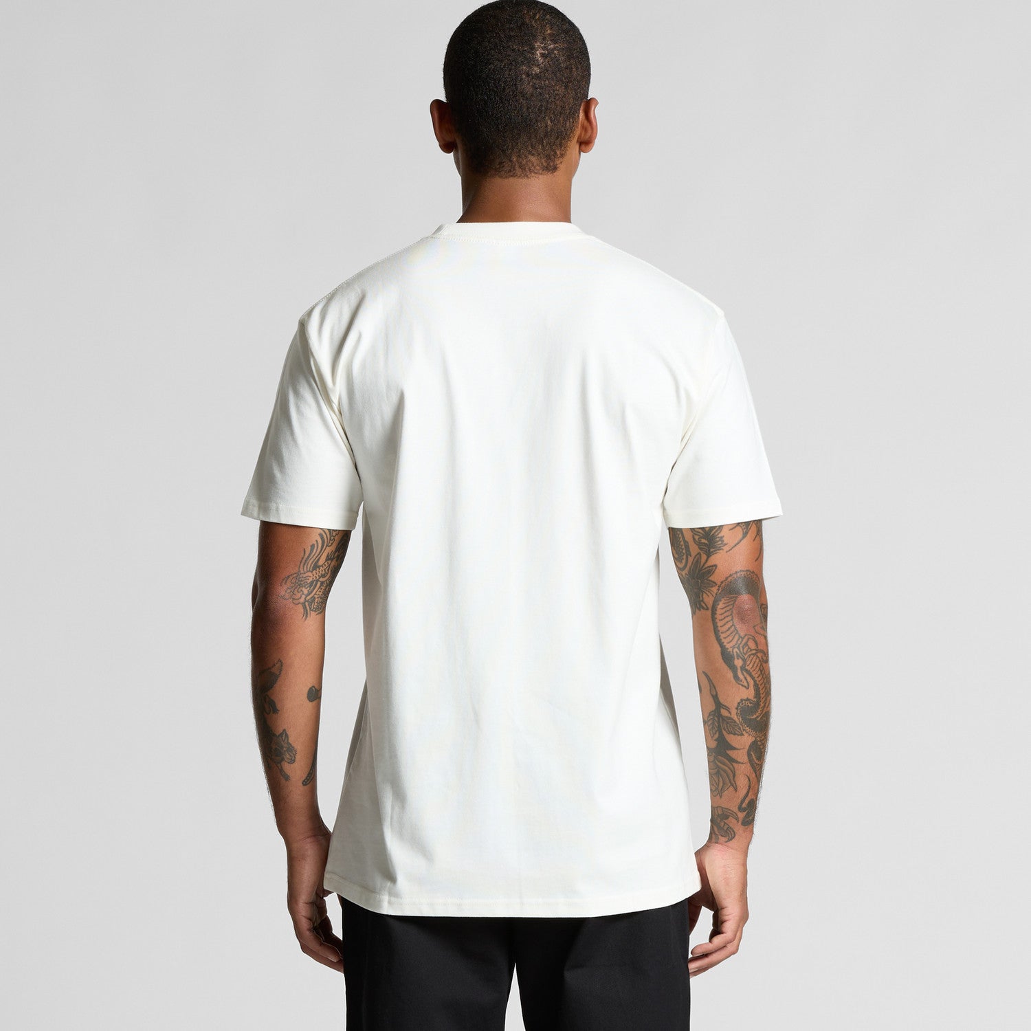 White t-shirt with graphic design on back