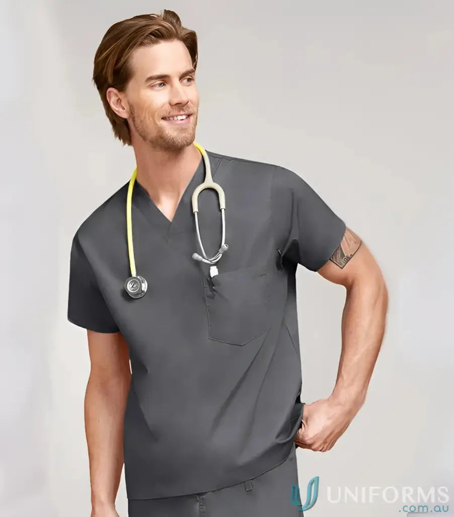 Smiling man in dark gray V‑Neck Scrub Top with chest pocket and digital print