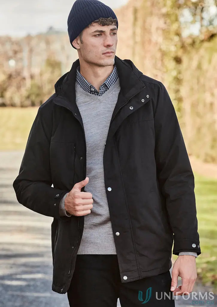 Man in black waterproof jacket and streetworx beanie to stay warm in temperature drops