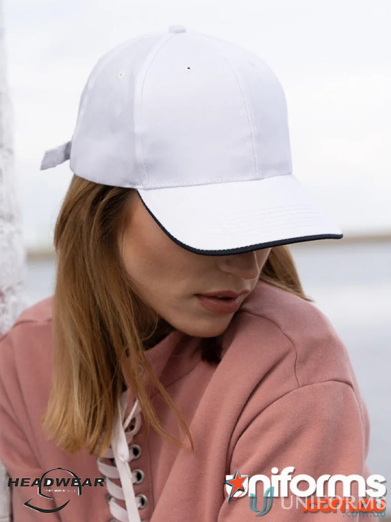 White baseball cap with dark trim from the recycled earth friendly cap collection