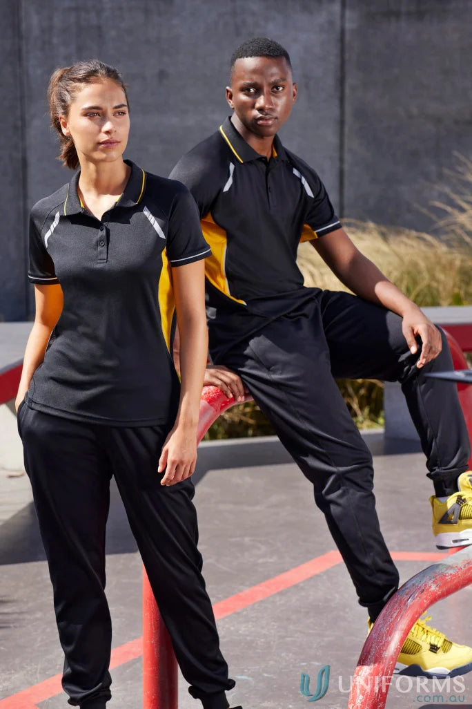 Matching black and gold athletic outfits from Men’s Renegade Polo Biz Collection with UPF rating