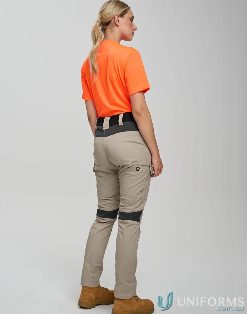 Women’s beige ripstop stretch work pants with black knee patches and multiple load-bearing pockets