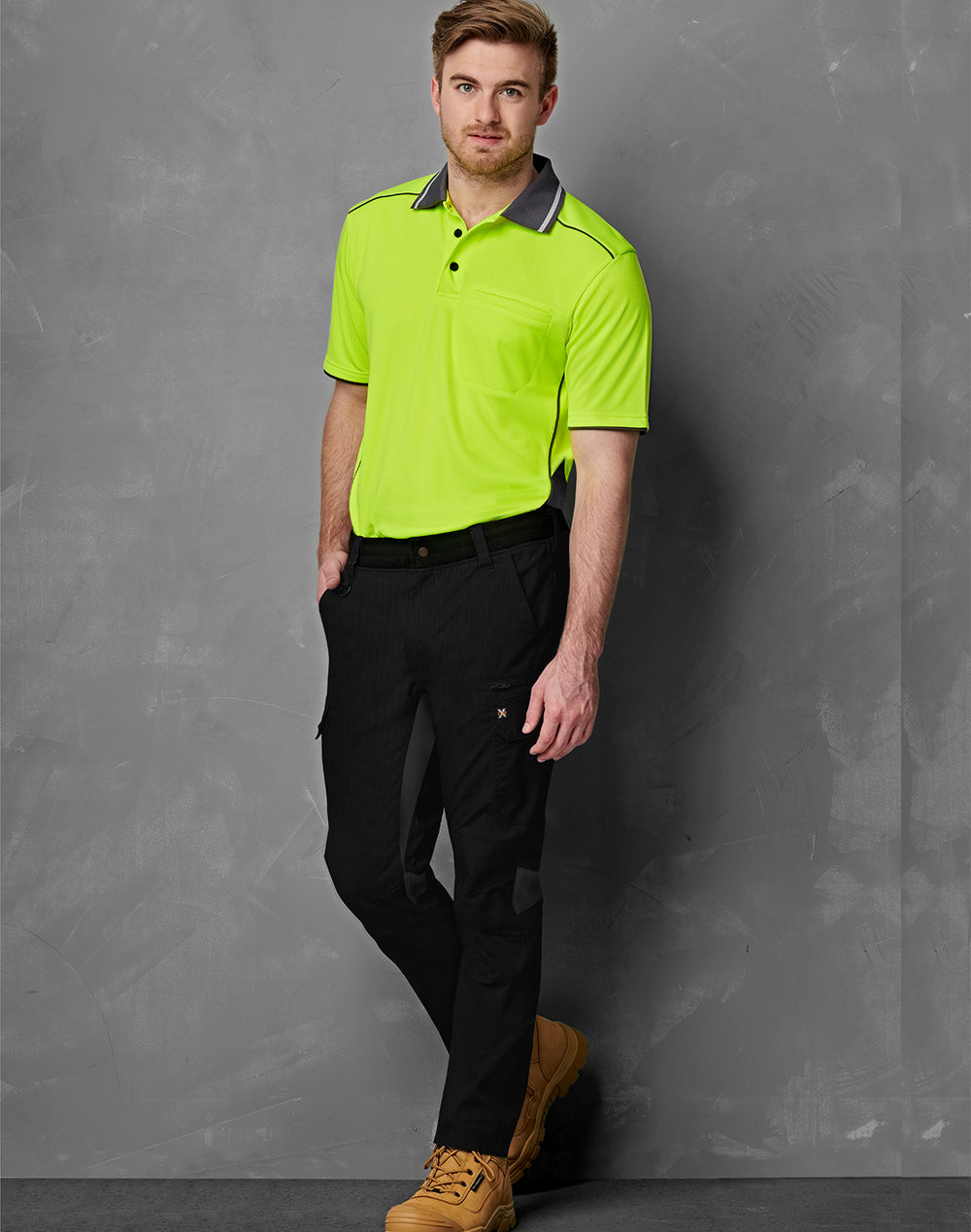 Bright neon green polo with ripstop stretch work pants pockets