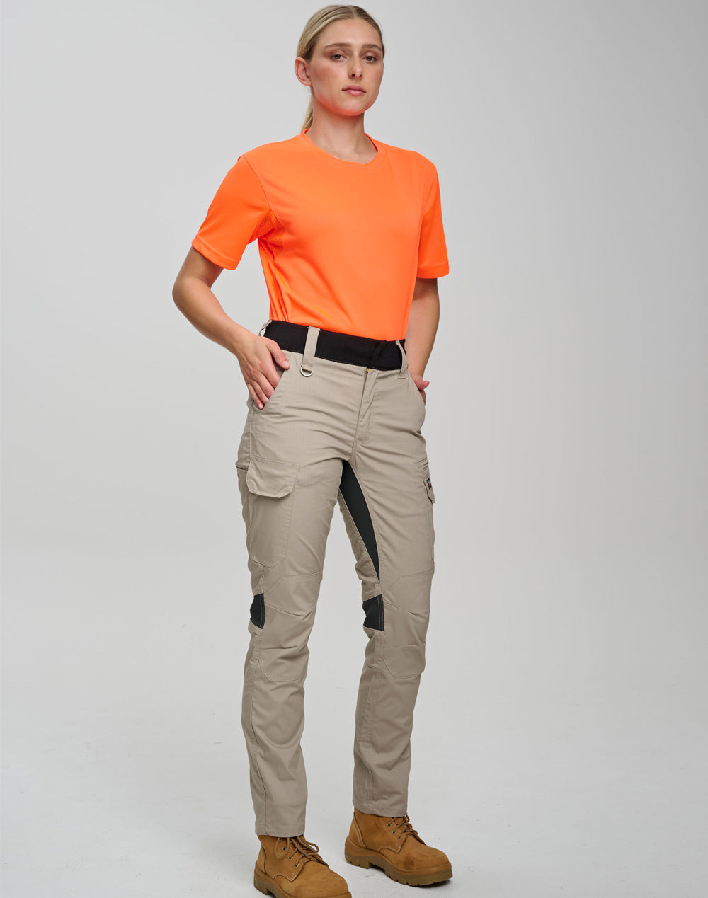 Beige ripstop stretch work pants with orange shirt and multiple load-bearing pockets