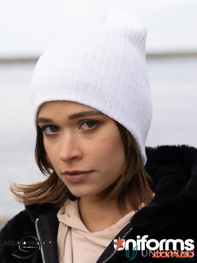 White knit beanie with cable knit design, perfect for uniforms and workwear style