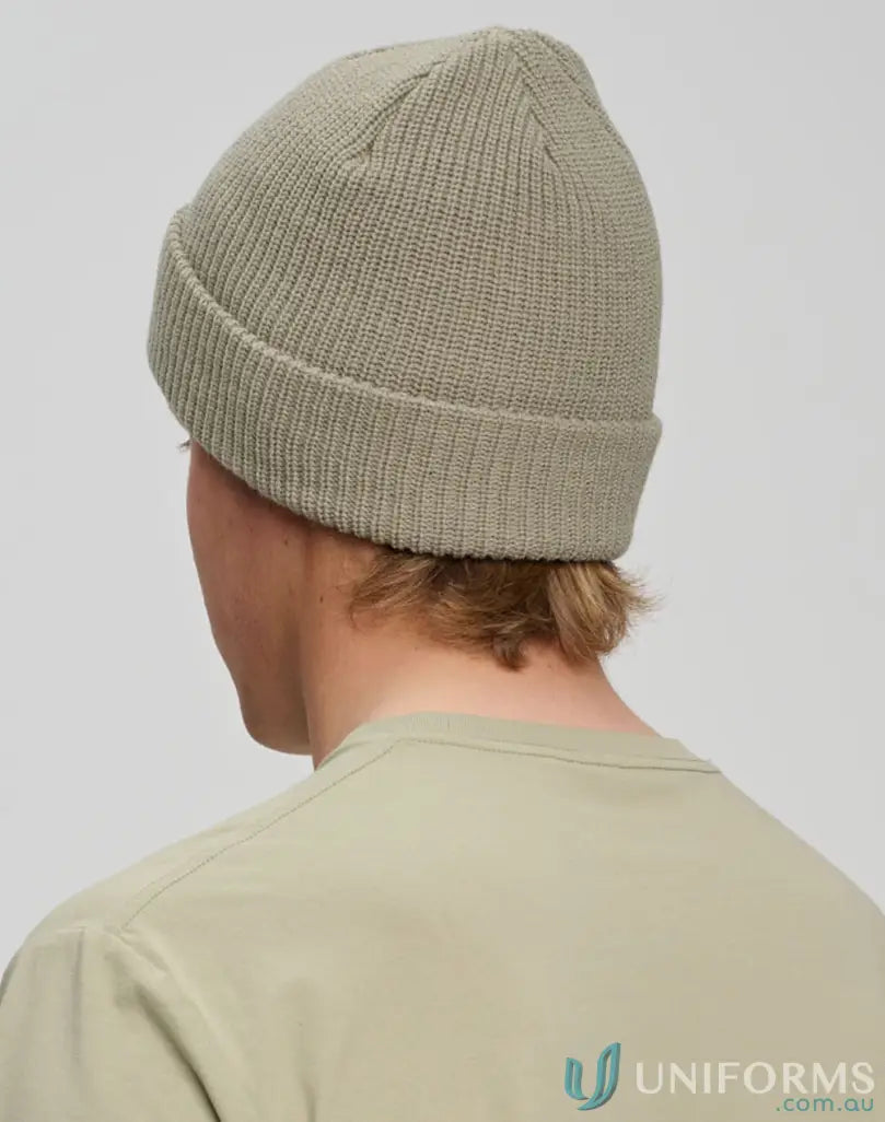 Cable knit pattern knit snug beanie in winning spirit roll style perfect for chilly days