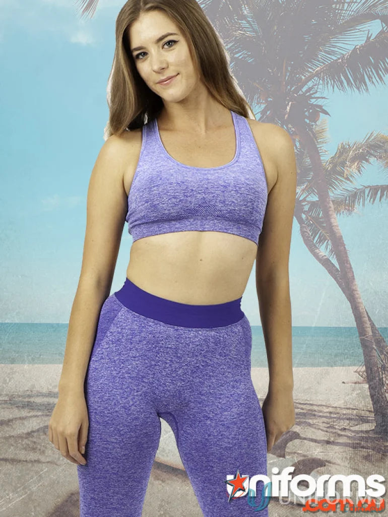 Woman in purple ladies size seamless crop top with four-way stretch for workout uniforms