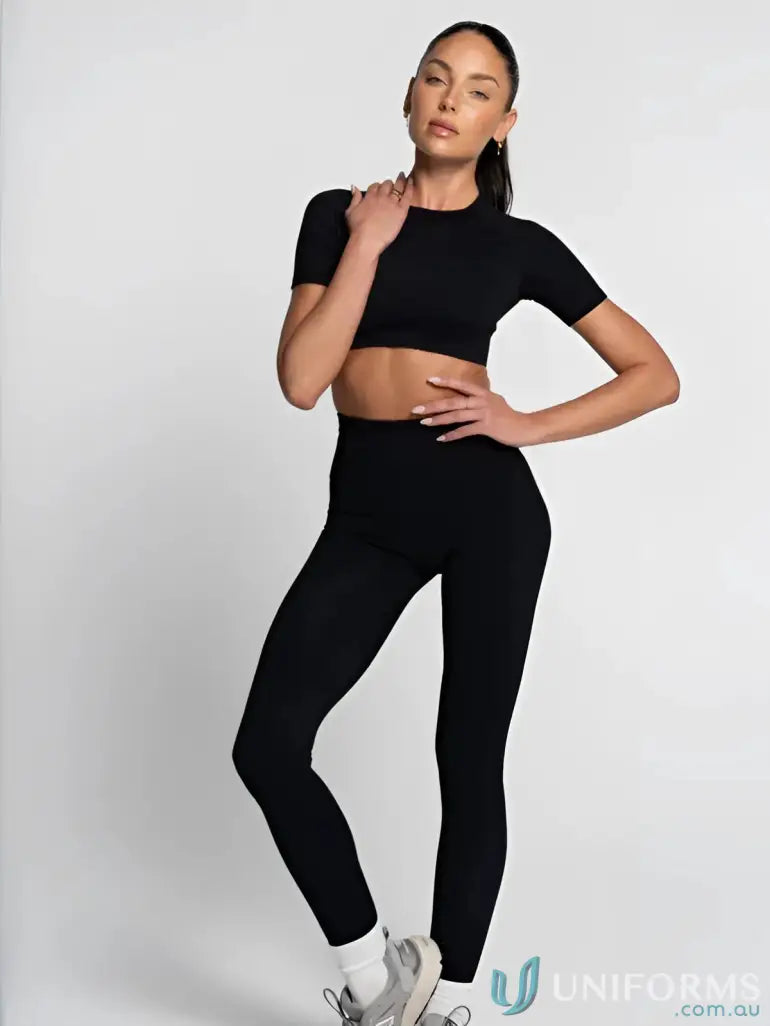 Black athletic seamless tee and cropped leggings set with round neck design
