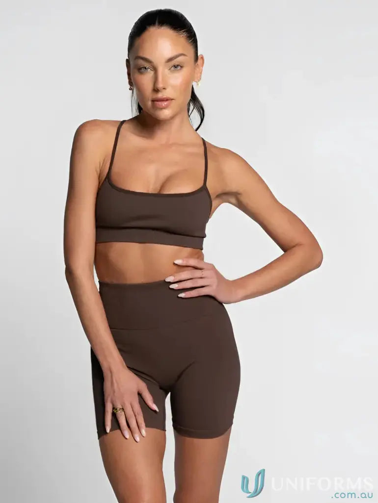 Brown athletic bra and shorts set with flattering scoop neckline for a stylish workout look