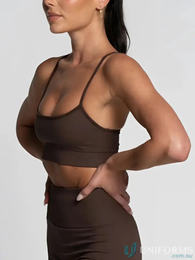 Brown ribbed athletic bra and leggings featuring a flattering scoop neckline for active wear