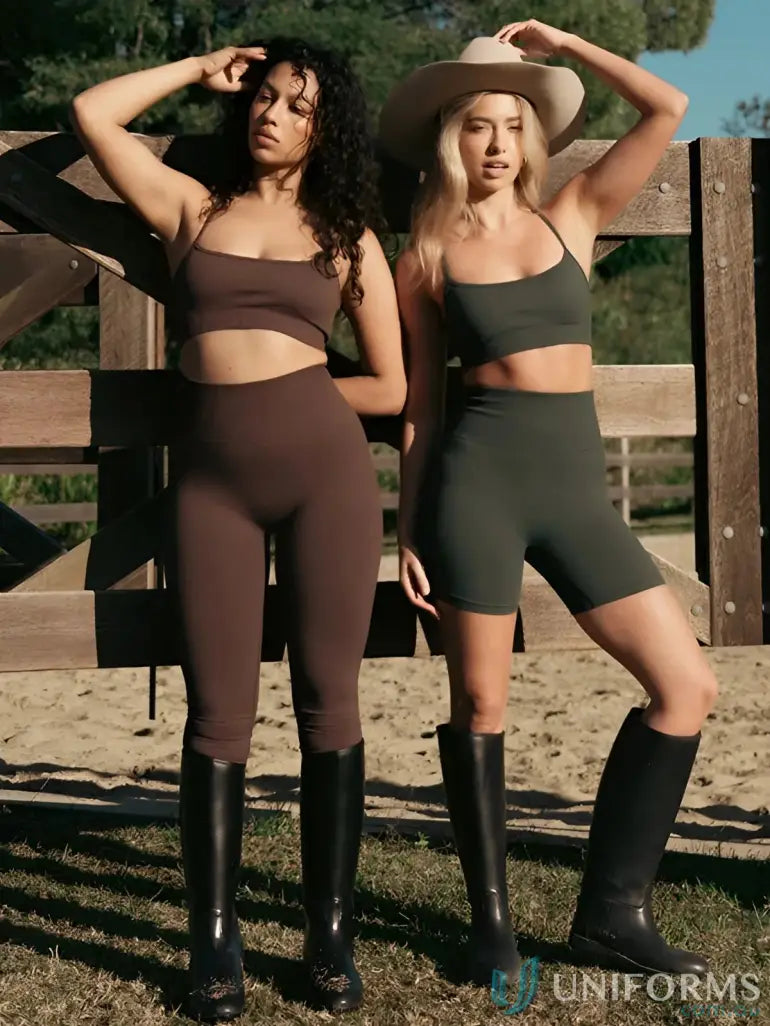 Two women in athletic wear and riding boots showcasing Seamless Invicible Scrunch Espresso Leggings, perfect work uniforms