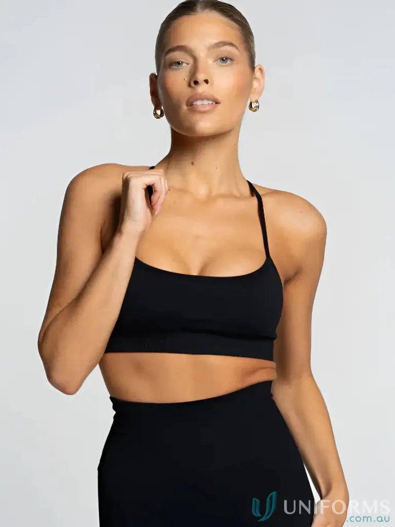 Black athletic crop top with flattering scoop neckline in the Seamless Onyx Active Crop