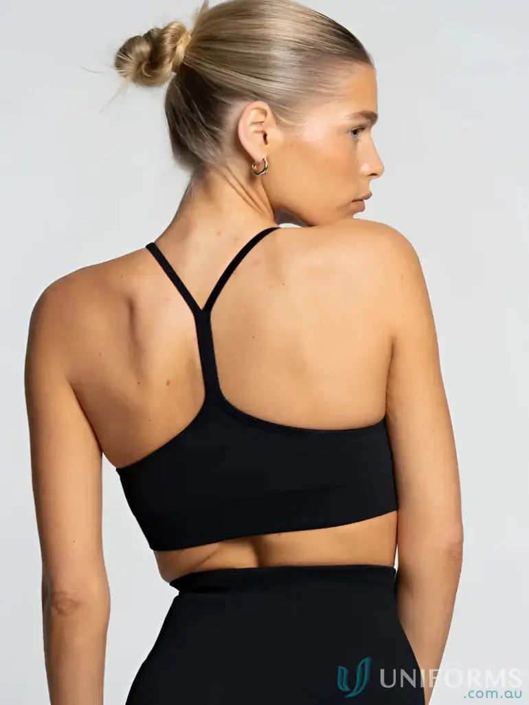 Black racerback sports bra with flattering scoop neckline for Active Crop workout style