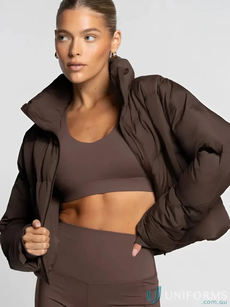 Brown puffer jacket with cropped hem and elasticised trim, perfect for uniforms