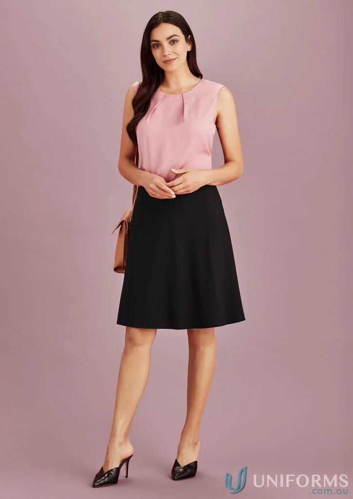 Woman in pink top and black Siena Bandless Flared Skirt showing stylish women’s Siena looks