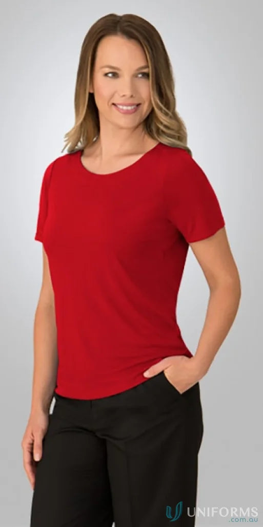 Woman in red stretch knit short sleeve top, perfect for uniforms or casual wear