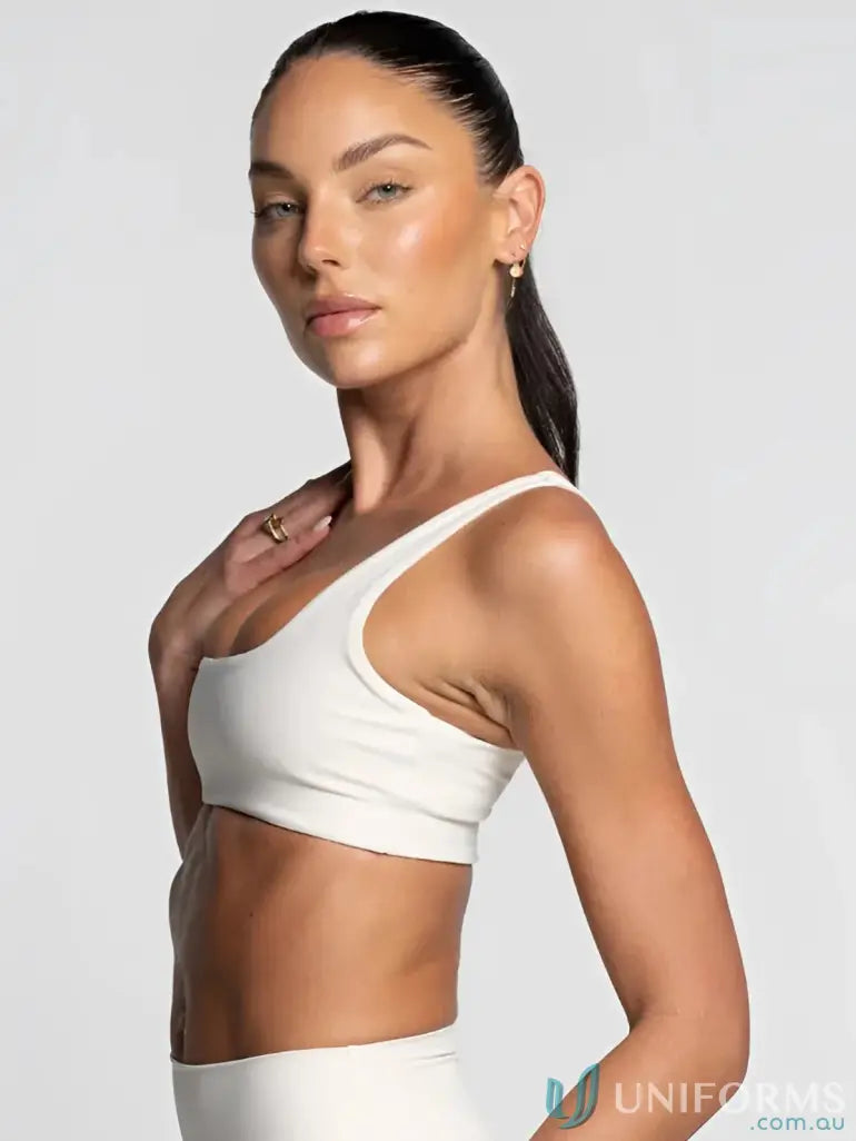 Woman wearing a white square neck offwhite crop top, perfect for sports or uniforms