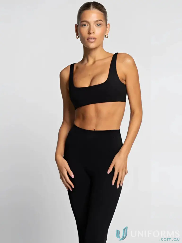 Black athletic bra and leggings set with square neck for trendy workout uniforms