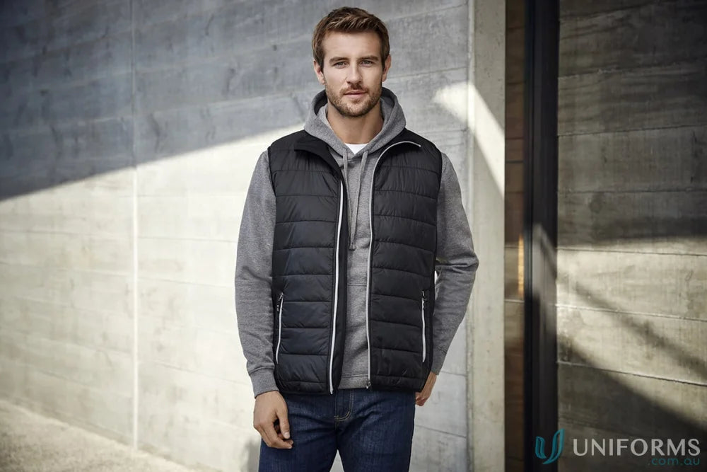 Man wearing a black men’s stealth vest from Stealth Vest collection with core warm polyfil insulation