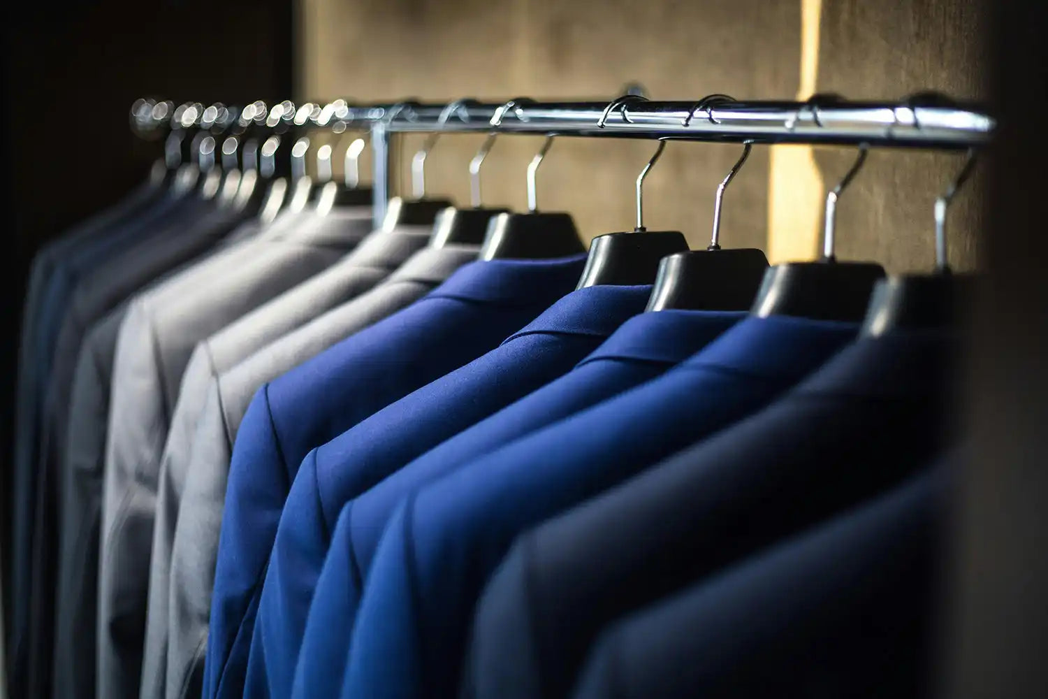 Suits hanging on a rack. Corporate Uniforms